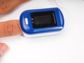 A man doing test using pulse oximeter