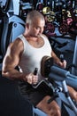 Man doing workout with pull-down machine