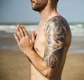 A man is doing a yoga at the beach Royalty Free Stock Photo