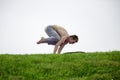 Man doing yoga exercises in the park Royalty Free Stock Photo