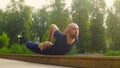 A man doing yoga exercises in the park Royalty Free Stock Photo