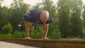 A man doing yoga exercises in the park Royalty Free Stock Photo