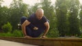 A man doing yoga exercises in the park Royalty Free Stock Photo