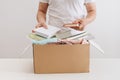 Man Donating Unwanted Items To Charity Shop Royalty Free Stock Photo