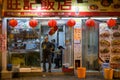 Man at the door of a restaurant in Hong Kong