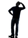 Man doubtful thinking silhouette full length Royalty Free Stock Photo