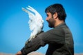 A Man With a Dove Opening Its Wings Royalty Free Stock Photo