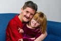 Man With Downs Syndrome Hugs His Great Niece Both Smiling