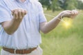 Man dowsing wirh dividing rod to locate ground water