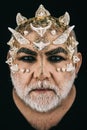 Man with dragon skin and white beard. Monster with sharp thorns and warts on face, horror and fantasy concept. Demon Royalty Free Stock Photo