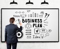 Man drawing a business plan sketch on whiteboard Royalty Free Stock Photo