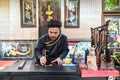 Man drawing calligraphy in Vietnam.