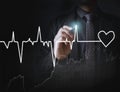 Man drawing heart and chart heartbeat Royalty Free Stock Photo