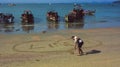 Man drawing a heart on the sand Royalty Free Stock Photo