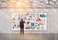 Man drawing startup sketch in geometric ceiling room, toned Royalty Free Stock Photo