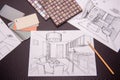 Man draws drawing, selects materials for the repair of apartments.