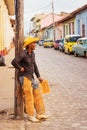 Man dressed as a cowboy advertises horseback riding for tourists