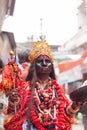 A man dressed as Goddess Kali