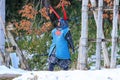 Man dressed for battle in traditional samurai style walks through snow