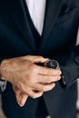 The man is dressed in a classic suit and an expensive wrist watch Royalty Free Stock Photo