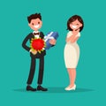 Man dressed in a suit gives a woman a bouquet of flowers