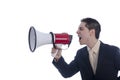 Man dressed in suit and tie shouting through megaphone. Royalty Free Stock Photo