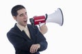 Man dressed in suit and tie shouting through megaphone. Royalty Free Stock Photo