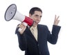 Man dressed in suit and tie shouting through megaphone. Royalty Free Stock Photo