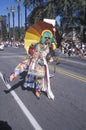 Man dressed in tie dye marching at the Doo Dah Parade, Pasadena, California