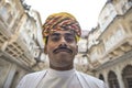 Man dressed in traditional Rajasthani clothing. With multicolored Pagri turban , Angrakha and Dhoti / Pajamas