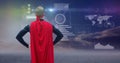 Man dressed up as superhero standing in front of futuristic interface