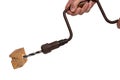 Man drilling a hole in a piece of woodwork with antique hand drill chest lyre and a clamped new wood bit. Clipping path. Macro. Royalty Free Stock Photo