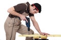 Man drilling hole in wood Royalty Free Stock Photo