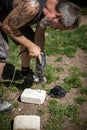 a man is drilling holes for dowels in stone or concrete Royalty Free Stock Photo