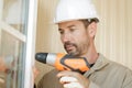 man drilling window Royalty Free Stock Photo