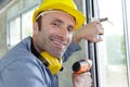 man drilling window frame Royalty Free Stock Photo
