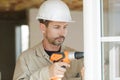 Man drilling window frame Royalty Free Stock Photo