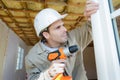 Man drilling window frame Royalty Free Stock Photo