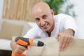 man drilling wood during table in renovation Royalty Free Stock Photo