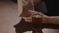 Man drink apple cider with chips on walnut table Royalty Free Stock Photo