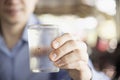 Man drink fresh cold pure water in glass