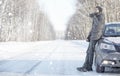 Man drink tea from mug outdoor on winter road Royalty Free Stock Photo