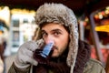 Man drink warm mullet wine on the Christmas Market Royalty Free Stock Photo