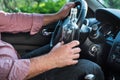 Man drinking alcohol in the car.