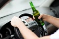 Man drinking alcohol while driving the car