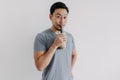 Man drinking boba tea or bubble tea deliciously isolated on white background.