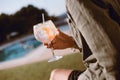 Man drinking cocktail near the pool Royalty Free Stock Photo