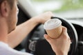 Man drinking coffee while driving the car Royalty Free Stock Photo