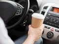 Man drinking coffee while driving the car Royalty Free Stock Photo