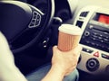 Man drinking coffee while driving the car Royalty Free Stock Photo